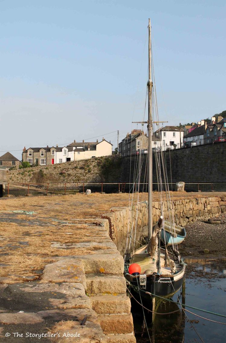 boat by harbour wall